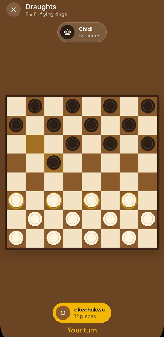 A Draughts board mid-game with pieces on the dark squares